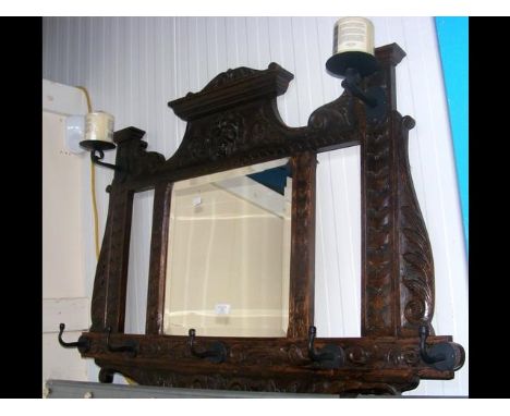 A carved oak coat rack 