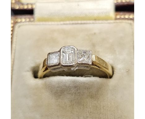 3 STONE DIAMOND RING CENTRE STONE IN A BAGUETTE FORM ON 18 CARAT GOLD SHANK, WEIGHT APPROX 3 GRAMS   Condition
