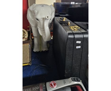 ELEPHANT SHAPED PLANTER, COMBINATION LEATHER MASTERS BRIEFCASE, HOOVER BATTERY POWERED VACUUM CLEANER   Condition