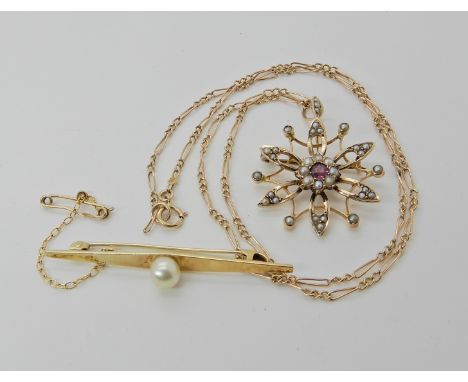 A 9ct gold Edwardian pink tourmaline and pearl set flower pendant, diameter 2.8cm, with a 9ct figaro chain 47cm, weight 6.5gm