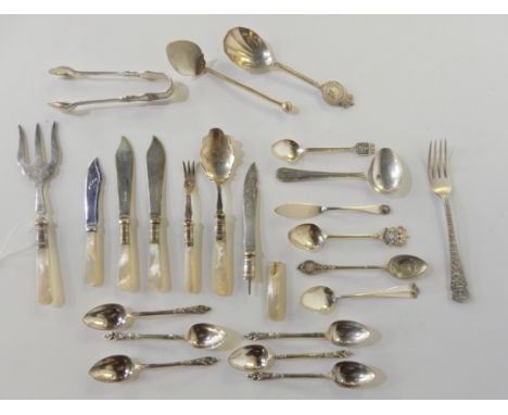 A lot comprising assorted EP spoons, forks, tongs etc, some with mother of pearl handles Condition Report: Available upon req