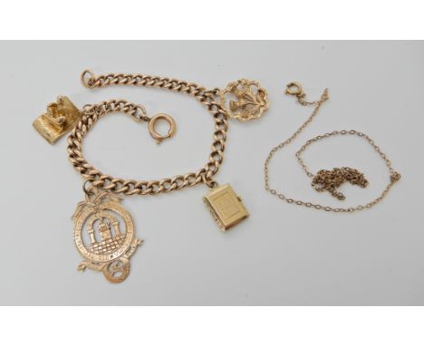 A 9ct gold curb link bracelet, hung with four charms to include; a 9ct magic carpet, and yellow metal Masonic medallion also 