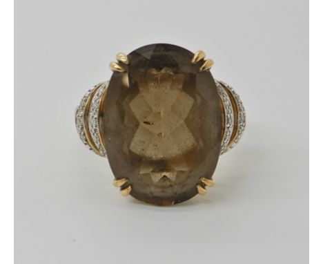 A 9ct gold smoky quartz and diamond ring by QVC, quartz approx 18mm x 13mm, size V1/2, weight 5.8gms Condition Report: light 