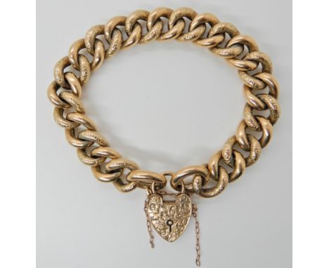 A 9ct gold curb link bracelet with heart shaped clasp, length 20.5cm, weight 30.2gms Condition Report: Light general wear. 