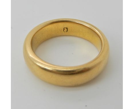 A bright yellow metal wedding ring, size K1/2, weight 9.2gms Condition Report: Available upon request