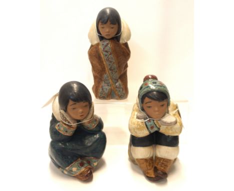 Three Lladro gres figures including Pensive Boy, no 2159, Pensive Girl no 2158, designed by Francisco Catalá and another of a