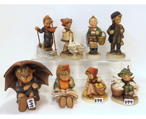 Eight Hummel figures including Umbrella Girl, Skier, Chick Girl, Goose Girl etc Condition Report: Available upon request