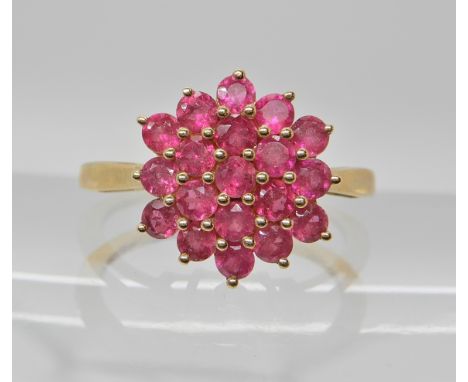 A 9ct gold ruby cluster ring, head size 13.5mm x 12.9mm, finger size N1/2, weight 2.4gms Condition Report: Available upon req