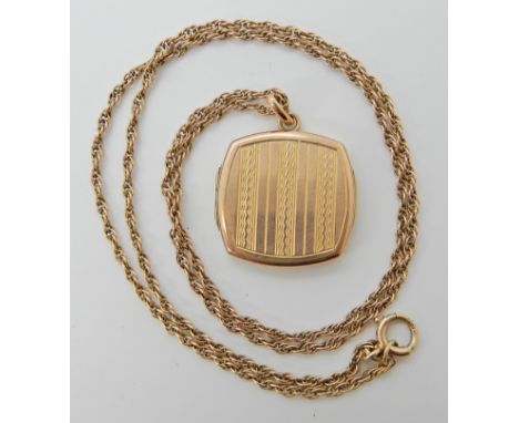 A 9ct engine turned engraved locket with 9ct rope chain length 48cm, weight 6.5gms Condition Report: Light general wear. 