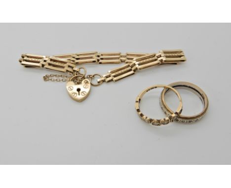 A 9ct gate bracelet length 17cm and two 9ct gem set rings, combined weight 13gms Condition Report: Available upon request