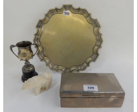 A lot comprising a silver cigarette box, London 1929, an EP card tray, a trophy cup and a resin polar bear figure Condition R