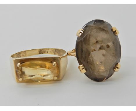 A bright yellow metal citrine set ring, size S together with a 9ct gold smoky quartz ring size J1/2, weight combined 8.2gms C