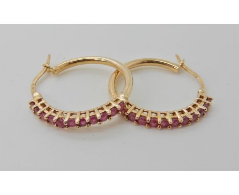 A pair of 9ct gold ruby set Creole earrings diameter approx 2cm, weight approx 3.3gms Condition Report: Available upon reques