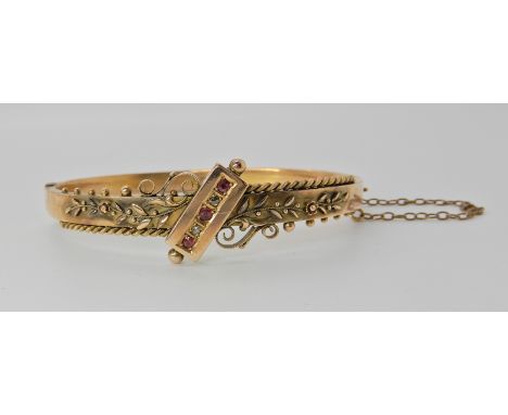 A 9ct gold red gem and diamond bangle, hallmarked Chester 1899, inner dimensions 5.7cm x 4.7cm, weight 8.1gms Condition Repor