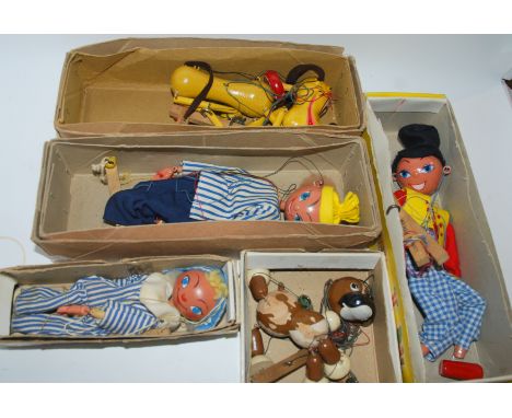 Four various Pelham puppets in original boxes and Andy Pandy puppet Condition Report: Available upon request