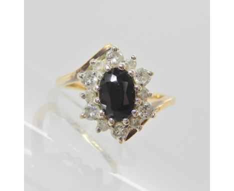 A 9ct gold sapphire and diamond cluster ring, size H, weight 2.1gms Condition Report: Available upon request