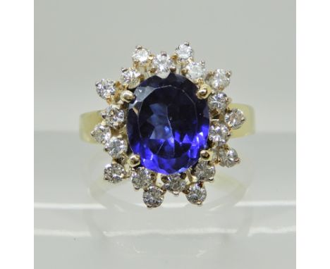 An 18ct gold faux sapphire and diamond cluster ring, head size 14.9mm x 13.8mm, size M, weight 4.3gms Condition Report: Avail