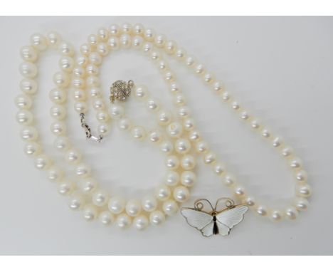 A silver gilt David Andersen white enamel butterfly brooch, a string of pearls with a silver clasp length approx 40cm and a s