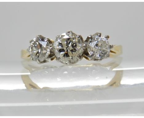 A bright yellow metal three stone diamond ring of estimated approx 1ct, finger size Q, weight 2.9gms Condition Report: Availa