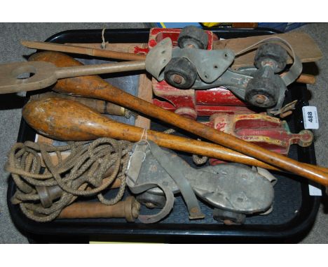 A tray lot including vintage roller skates, clubs and various books Condition Report: Available upon request