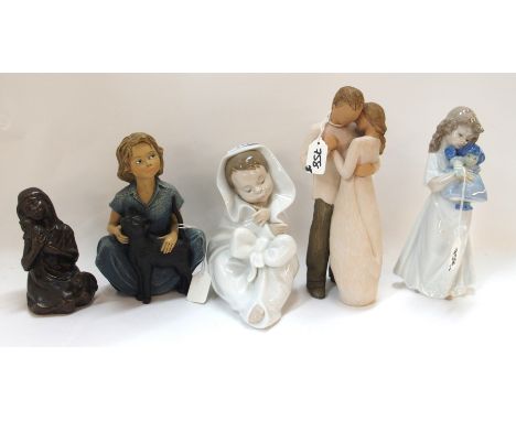 Two Nao figures including a girl cuddling a doll, 21 cm high and a boy wrapped in a blanket, 16cm high, a Willow Tree figure 