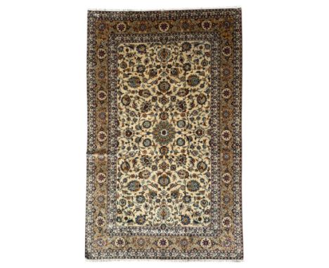 Kashan Persian rug, hand knotted, ivory ground rug, the rosette medallion decorated with projecting palmettes, on a field of 