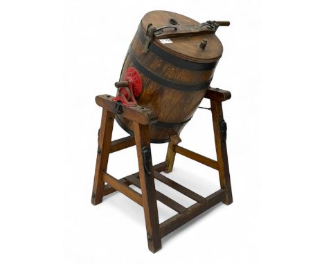 19th century oak and cast iron rotary butter churn, with coopered barrel body, domed lid with filler opening and cast iron se
