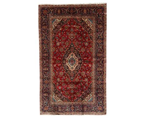 Ardakan Persian rug, hand knotted floral design with central medallion pattern with primary red, blue, and ivory coloursDimen