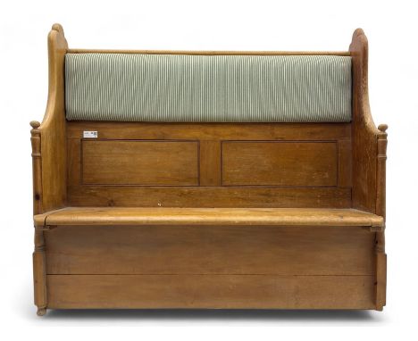Early 20th century waxed pine pew, inset upholstered striped back panel with hinged box seat enclosing storage, shaped arms a