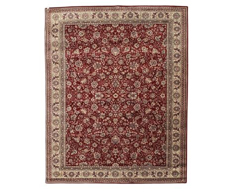 Royal Kashmir worsted wool modern Persian design area rug, with crimson field and stylised rosette patterning throughout, sur