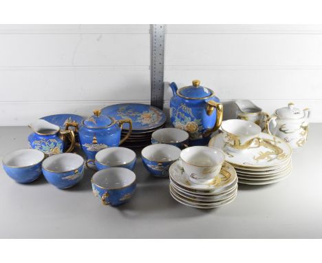 JAPANESE PORCELAIN TEA SET, THE BLUE GROUND WITH FLORAL DESIGN, TOGETHER WITH FURTHER JAPANESE PORCELAIN CUPS AND SAUCERS