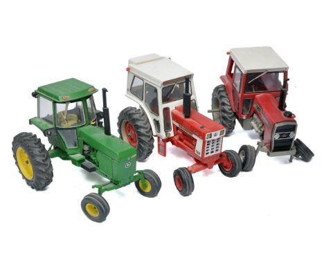 A group of assembled plastic Ertl Farm Model Tractor Kits, Massey in need of some attention. 