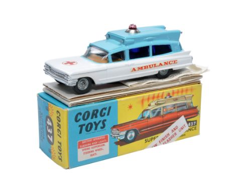 Corgi No. 437 Cadillac Superior Ambulance. Blue and White with brown interior. Cast hubs. Generally displays excellent, littl