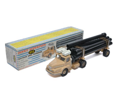 French Dinky No. 893 Unic Sahara Tractor with Pipe Trailer and Load. Displays very good to excellent, a few minor marks. In v
