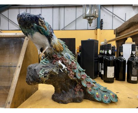 A LARGE MAJOLICA STYLE PEACOCK CERAMIC FIGURE, A/F HEIGHT APPROX 39CM, WIDTH 40CM 
