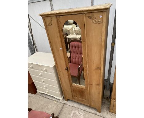 AN EARLY 20TH CENTURY PINE MIRROR-DOOR WARDROBE, 35" WIDE 