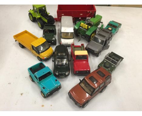A BRITAINS TRAILER, DIE-CAST VEHICLES TO INCLUDE LAND ROVERS, VANS, TRACTOR, PLUS A JOHN DEERE TIN PLATE TRACTOR 