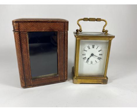 A 19TH CENTURY BRASS CASED, PROBABLY FRENCH, CARRIAGE CLOCK IN ORIGINAL LEATHER CASE, HEIGHT 14CM 