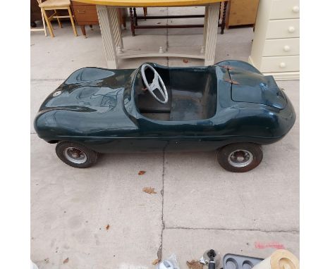 A TOTROD CHILDS CAR 1960s WATSONIAN CHEETAH CUB MODEL IN THE STYLE OF A D-TYPE JAGUAR IN BRITISH RACING GREEN WITH A FOUR STR