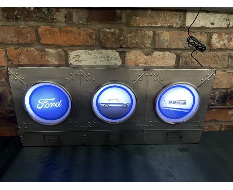 A FORD RS2000 ILLUMINATED LIGHT BOX SIGN WITH THREE IMAGES IN SEPERATE HEADLIGHT DESIGN- WORKING ORDER AT TIME OF CATALOGUING