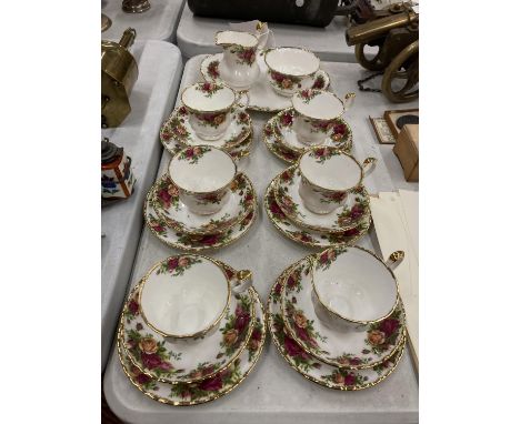 A QUANTITY OF ROYAL ALBERT 'COLD COUNTRY ROSES' TO INCLUDE CUPS, SAUCERS, SIDE PLATES, A CREAM JUG, SUGAR BOWL AND CAKE PLATE