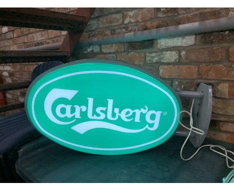 A CARLSBERG, DOUBLE SIDED ILLUMINATED LIGHT BOX SIGN - WORKING ORDER AT TIME OF CATALOGUING.  WIDTH 83CM, HEIGHT 45CM, DEPTH 