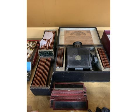 A BING GERMAN BOXED SLIDE LANTERN WITH ASSORTED SLIDES 
