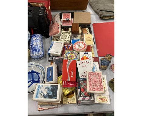 A LARGE AMOUNT OF VINTAGE PLAYING CARDS TO INCLUDE AIRWAYS, WHISKY, CIGARS, ETC PLUS A BACKGAMMON SET, CRIBBAGE BOARD, ETC 