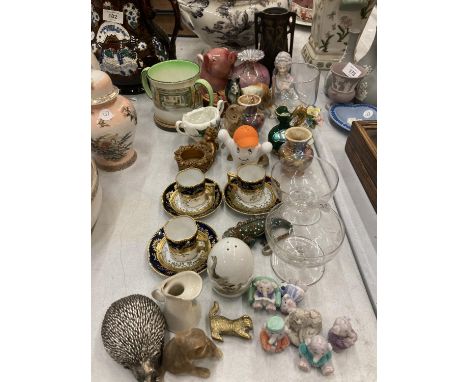 A MIXED LOT TO INCLUDE SMALL CUPS AND SAUCERS, ANIMAL FIGURES, GLASSWARE, A DOULTON MUG, ETC 