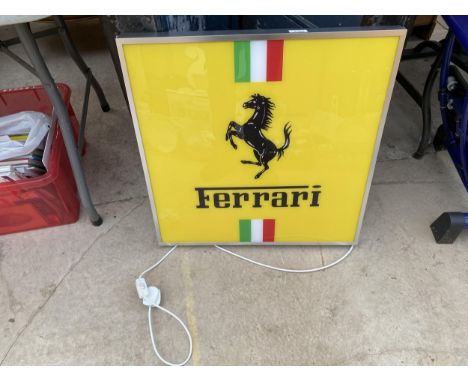 A LARGE  FERRARI ILLUMINATED LIGHT BOX SIGN - WORKING ORDER AT TIME OF CATALOGUING.  WIDTH 61CM, HEIGHT 64CM 