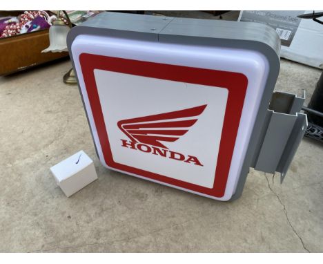 A HONDA DOUBLE SIDED ILLUMINATED LIGHT BOX SIGN - WORKING ORDER AT TIME OF CATALOGUING.  WIDTH 46CM, HEIGHT 40CM, DEPTH 14CM 