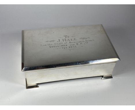 AN ART DECO 1930'S HALLMARKED BIRMINGHAM SILVER OVER-SIZED CIGARETTE BOX WITH SHELL-MEX &amp; B.P INSCRIPTION, LENGTH 24CM, T