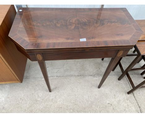 A 19TH CENTURY MAHOGANY AND CROSSBANDED FOLD-OVER CARD TABLE WITH CANTED FRONT ON TAPERING LEGS, 36" WIDE 