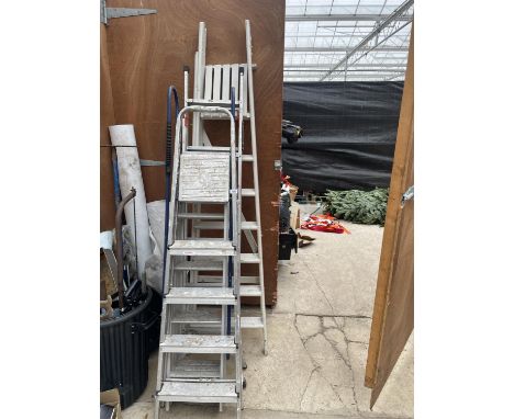 FOUR VARIOUS LADDERS TO INCLUDE A SIX RUNG WOODEN STEP LADDER, TWO ALUMINIUM STEP LADDERS AND A THREE SECTION LOFT LADDER ETC